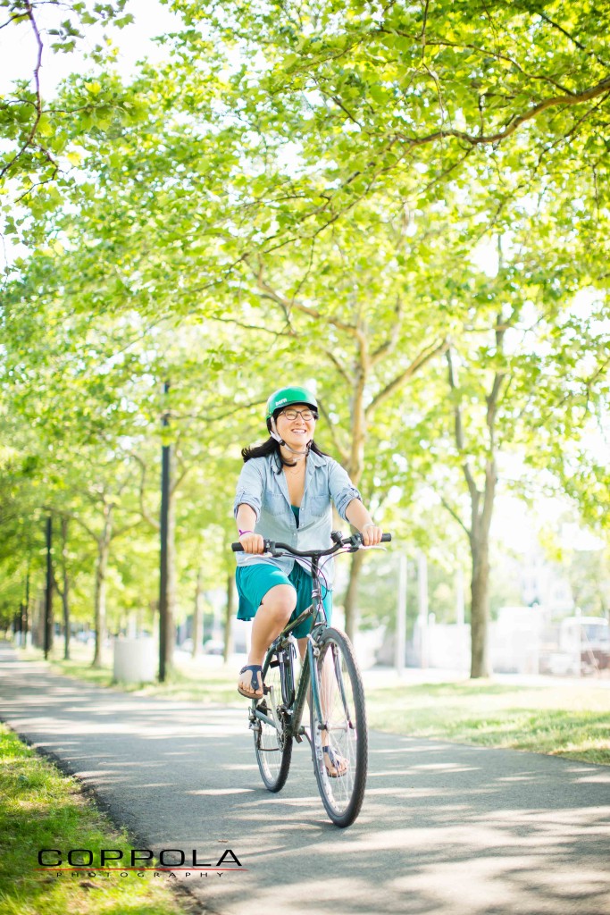 Coppola Photography Boston Bike Image Asian Woman Smiling on Bike Path