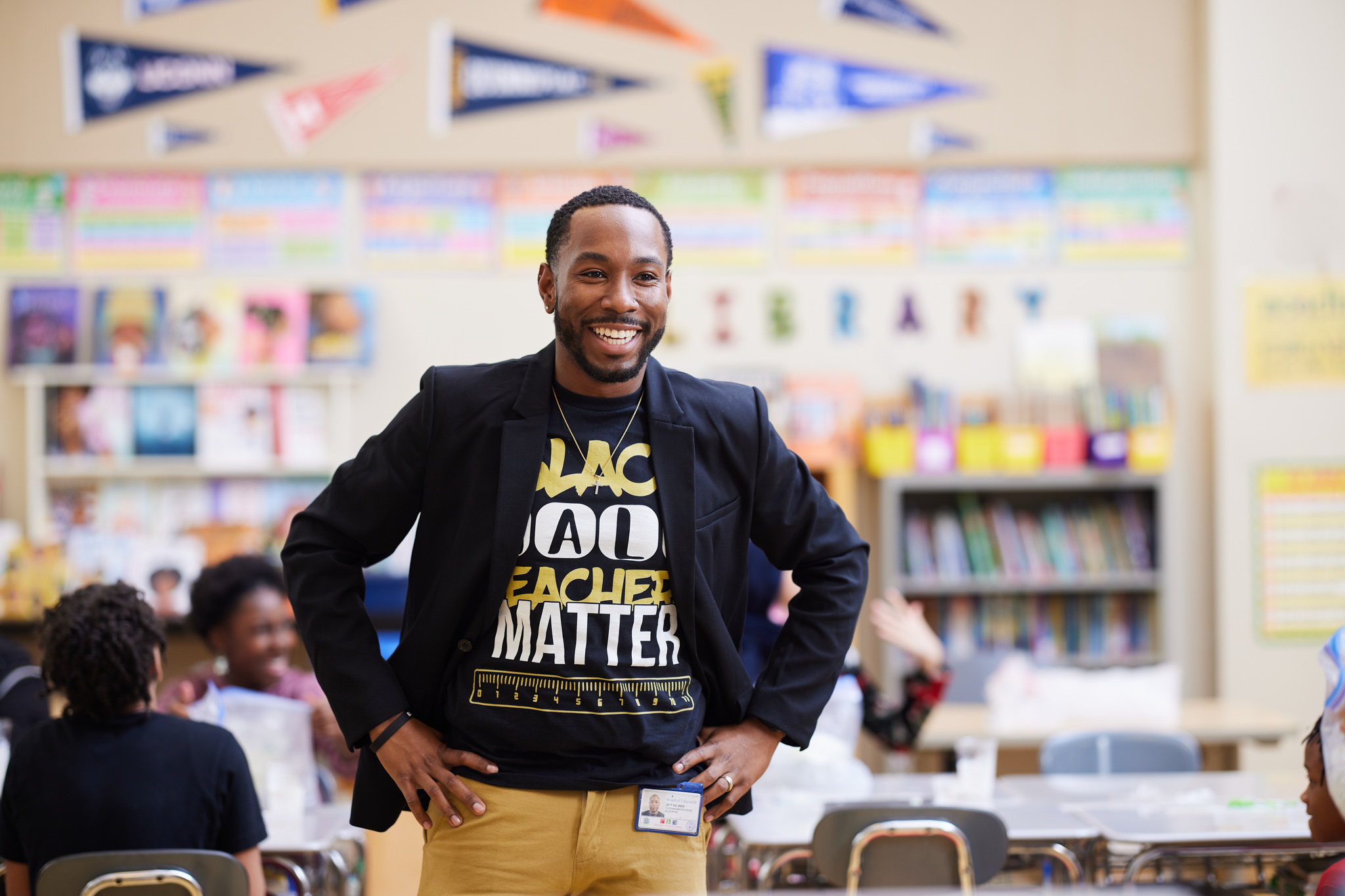 Education Photography: A Black Male Teacher Smiles at His Classroom